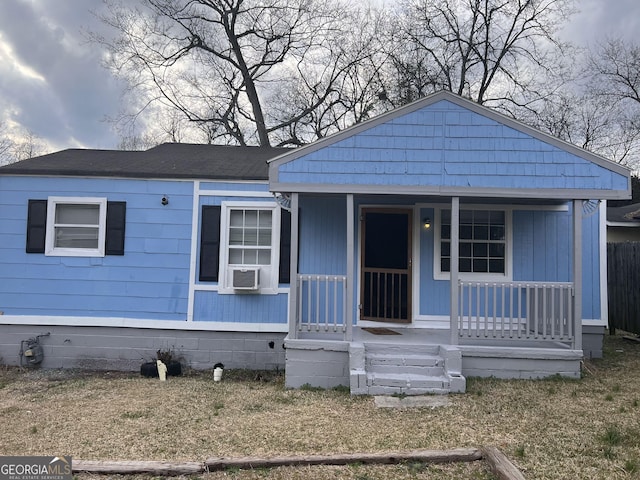 view of front of house featuring cooling unit and covered porch