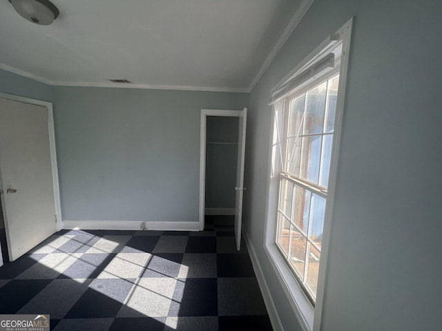 spare room with ornamental molding