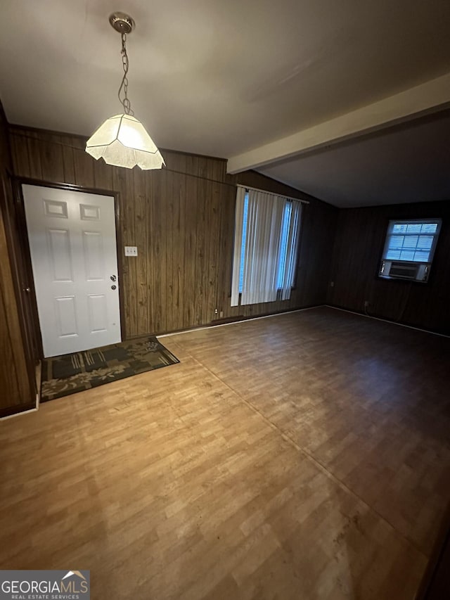 entrance foyer with wooden walls and beam ceiling