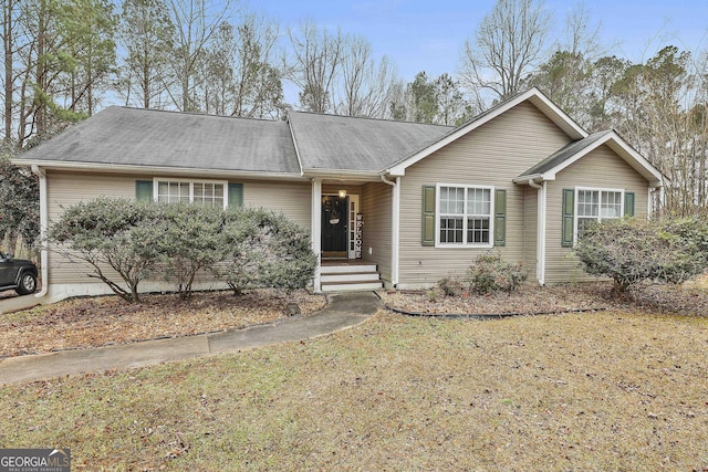 ranch-style house with a front yard