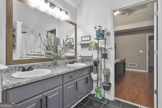 bathroom featuring vanity, tile patterned flooring, and a shower with curtain