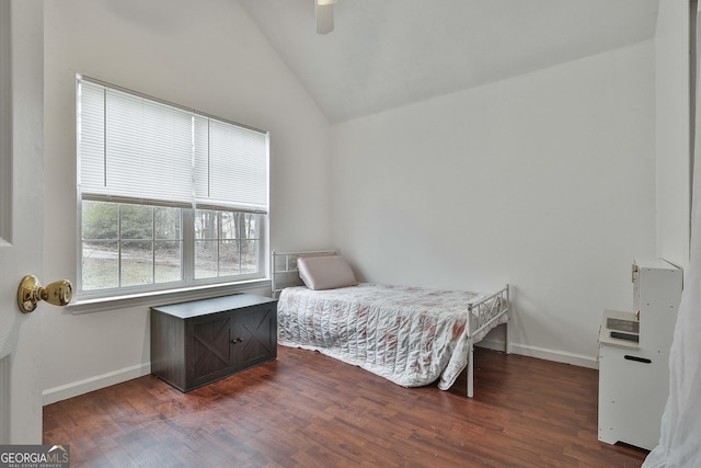 bedroom featuring dark wood-type flooring, ceiling fan, and lofted ceiling