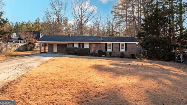 ranch-style home featuring a carport