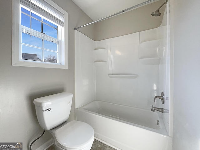 bathroom featuring toilet and bathing tub / shower combination