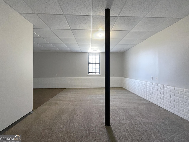 basement with carpet and a drop ceiling