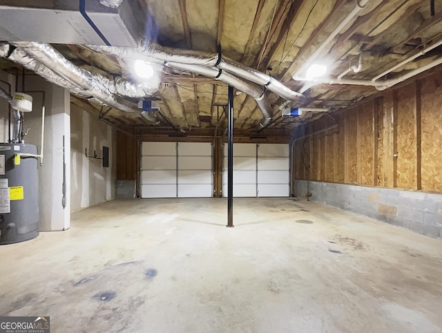 garage with a garage door opener and water heater