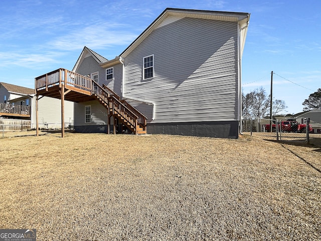 back of property featuring a deck