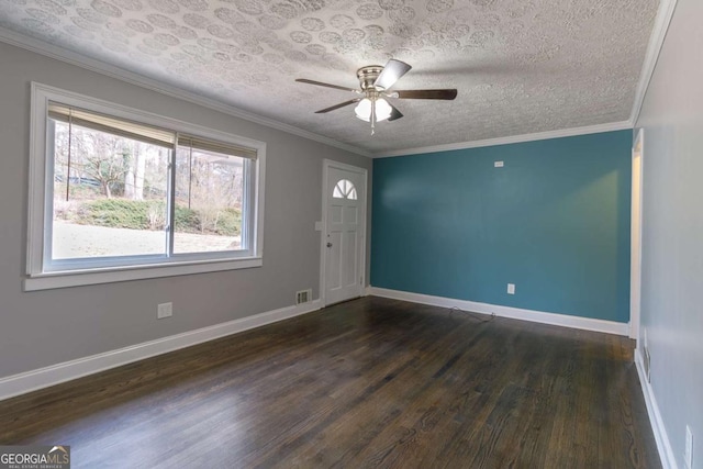 unfurnished room featuring crown molding, ceiling fan, dark hardwood / wood-style floors, and a textured ceiling