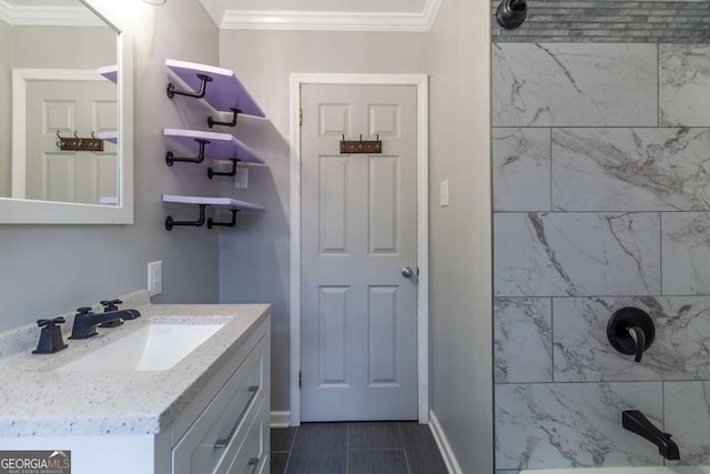 bathroom featuring vanity, a tile shower, and crown molding