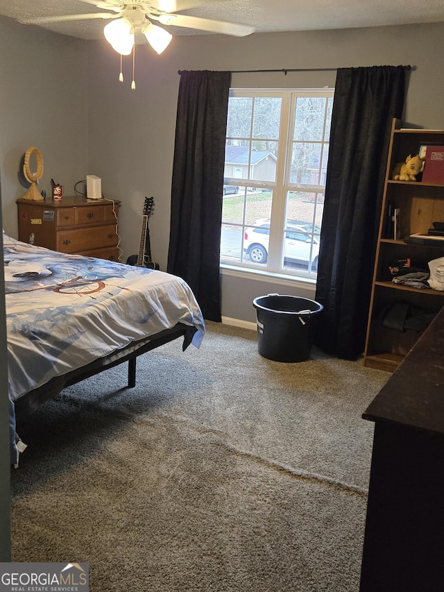 bedroom featuring ceiling fan and carpet floors