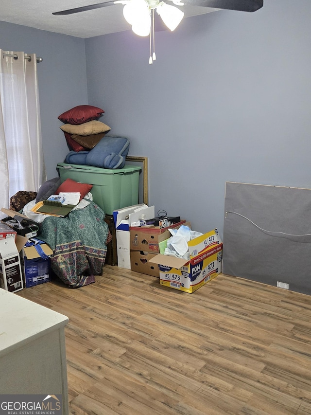 bedroom featuring hardwood / wood-style floors and ceiling fan