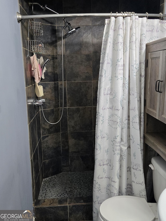 bathroom with toilet and curtained shower