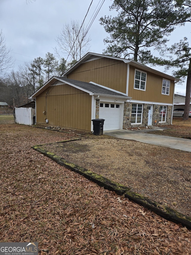 view of side of home featuring a garage