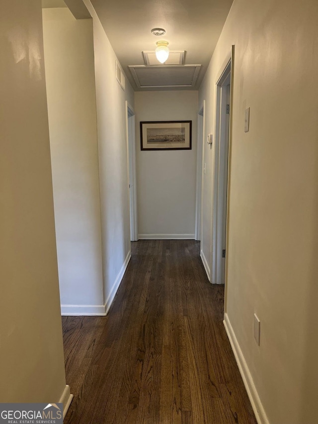 corridor with dark hardwood / wood-style floors