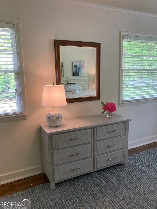 room details with crown molding and hardwood / wood-style flooring