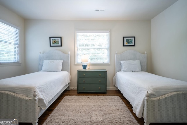 bedroom featuring dark hardwood / wood-style flooring