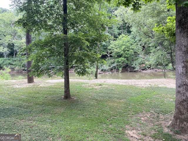 view of yard with a water view