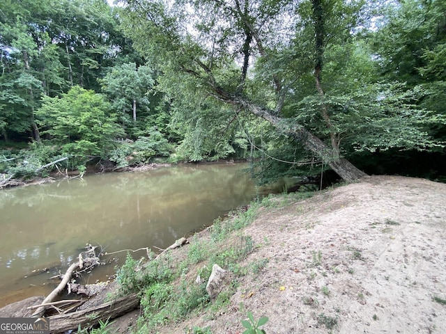 view of landscape with a water view