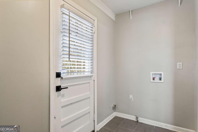 laundry room featuring washer hookup, hookup for an electric dryer, and dark tile patterned floors