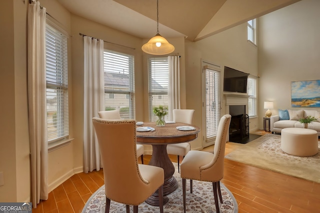 dining room with lofted ceiling