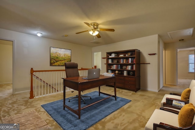 office featuring light carpet and ceiling fan