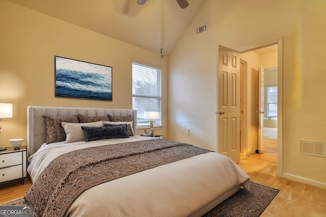 bedroom with lofted ceiling, light wood-type flooring, and ceiling fan