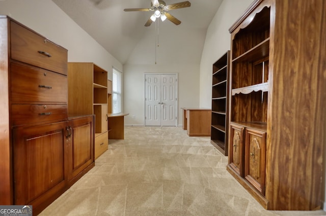 home office featuring lofted ceiling, light colored carpet, and ceiling fan