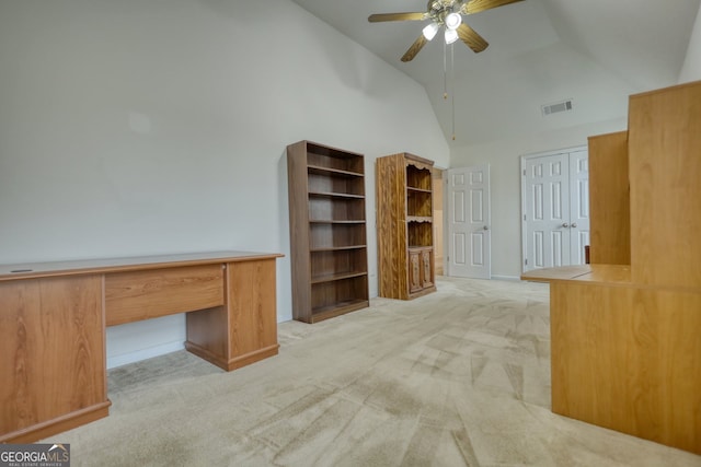 unfurnished office with ceiling fan, light colored carpet, and high vaulted ceiling