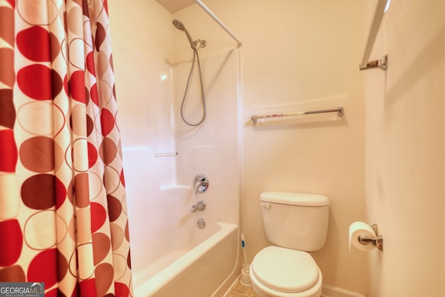 bathroom featuring toilet and shower / tub combo