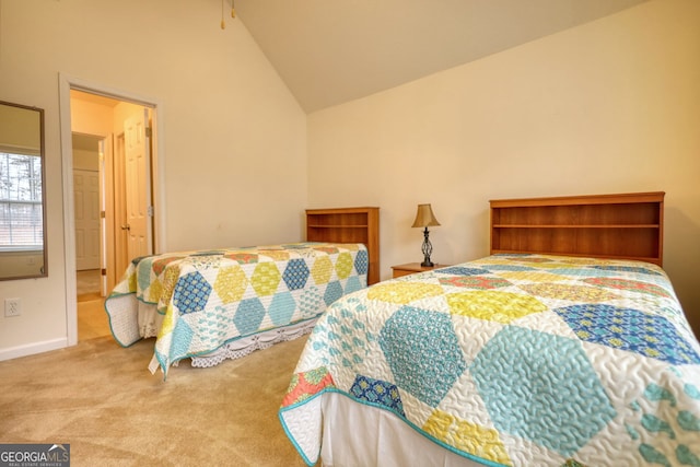 carpeted bedroom with high vaulted ceiling