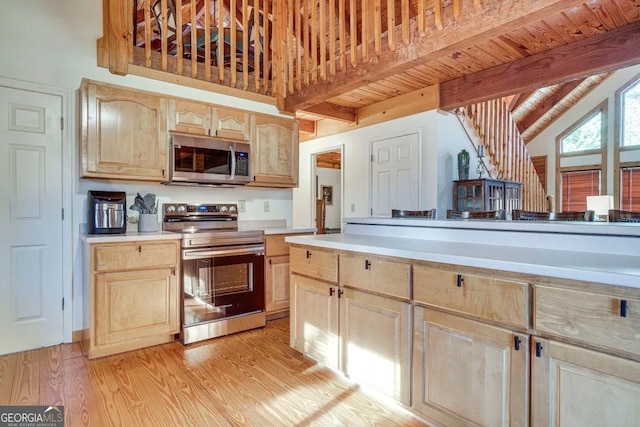 kitchen with wooden ceiling, light brown cabinets, appliances with stainless steel finishes, beamed ceiling, and light hardwood / wood-style floors