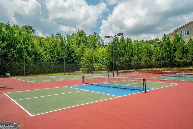 view of sport court featuring basketball hoop