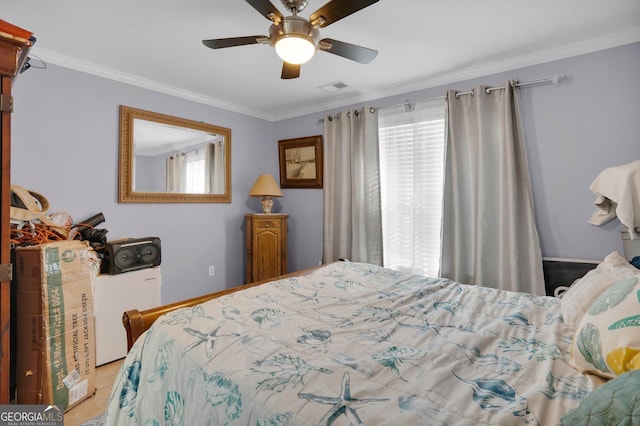 bedroom with ornamental molding and ceiling fan