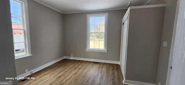 interior space featuring crown molding and light wood-type flooring