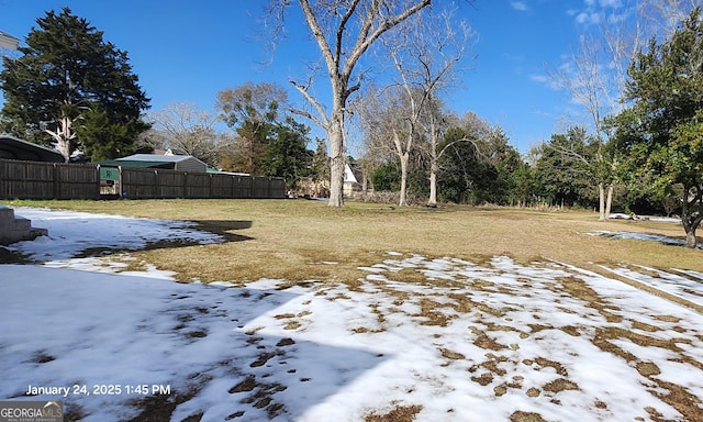 view of yard covered in snow