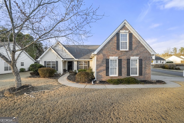 traditional-style house featuring brick siding