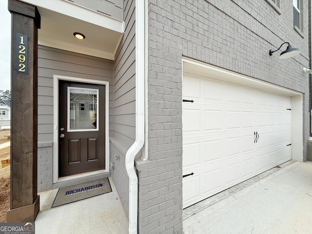 property entrance with a garage