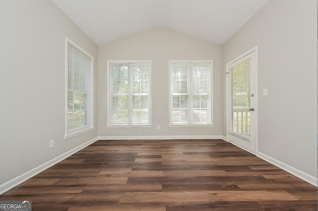 unfurnished sunroom featuring vaulted ceiling