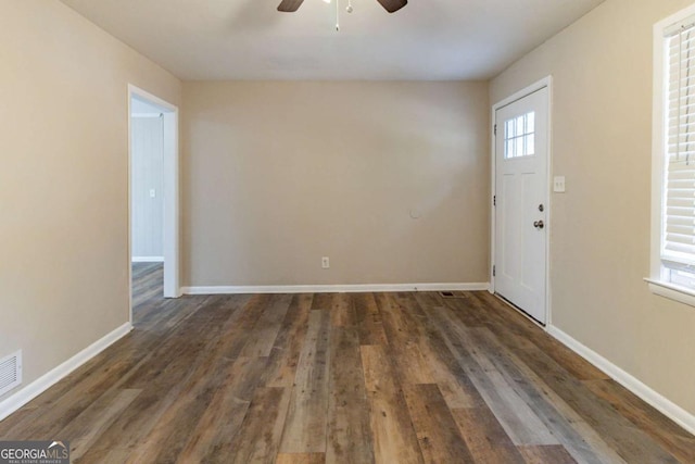 foyer with dark hardwood / wood-style floors and ceiling fan