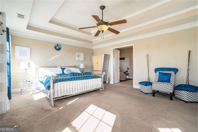 bedroom featuring carpet, a raised ceiling, visible vents, ornamental molding, and a ceiling fan