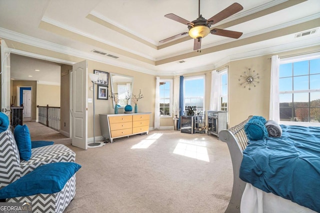 carpeted bedroom with access to outside, a raised ceiling, visible vents, and crown molding