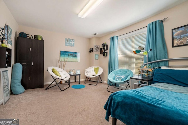 carpeted bedroom with baseboards and visible vents