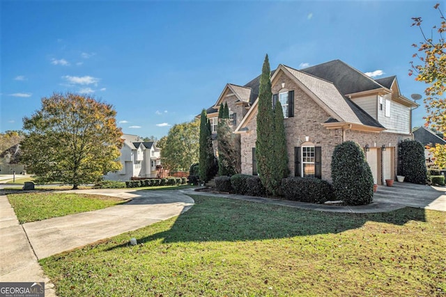 view of side of home featuring brick siding, concrete driveway, a lawn, an attached garage, and stone siding