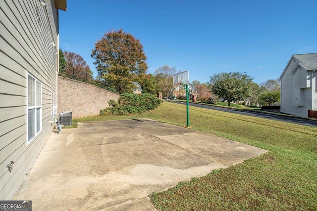 view of patio / terrace featuring central AC unit and fence