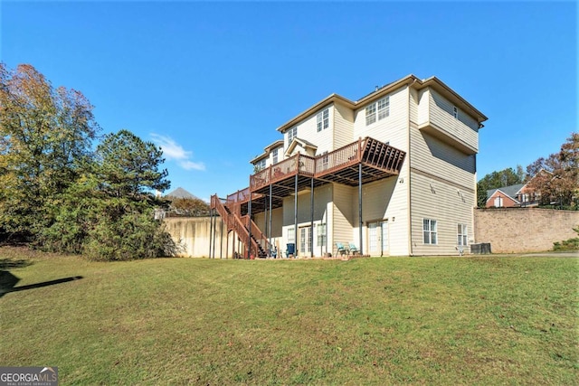 rear view of house with a yard, stairway, cooling unit, and a wooden deck