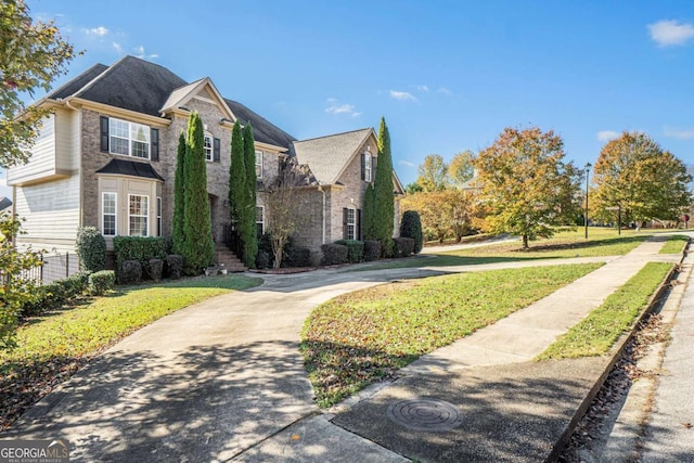 view of property exterior with stone siding and a yard