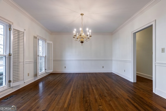 unfurnished dining area with crown molding, dark hardwood / wood-style floors, and a chandelier