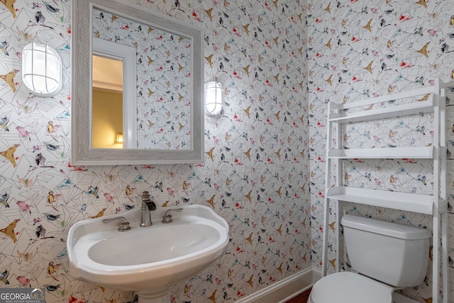 bathroom with sink and toilet