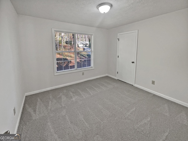 2268 Turtle Club Dr NE, Marietta, GA 30066 - carpeted empty room featuring a textured ceiling and baseboards