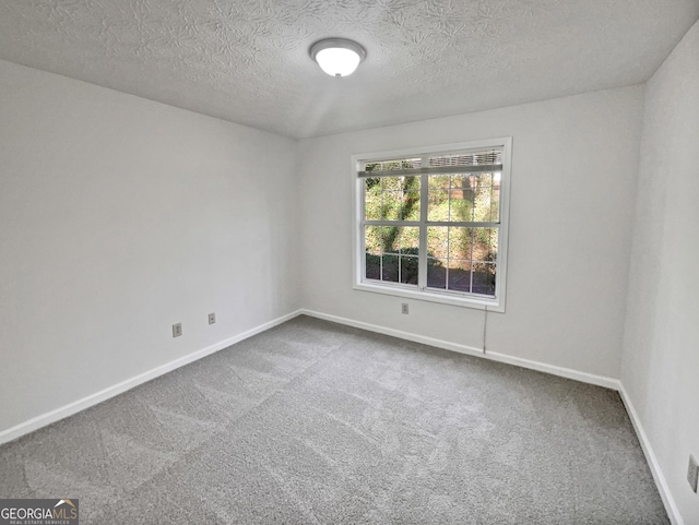 2268 Turtle Club Dr NE, Marietta, GA 30066 - carpeted spare room featuring baseboards and a textured ceiling